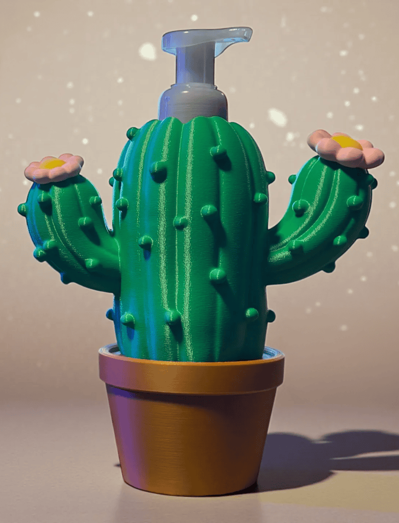 Colorful 3D printed cactus with pink flowers in a pot. Acadiana3DPrints