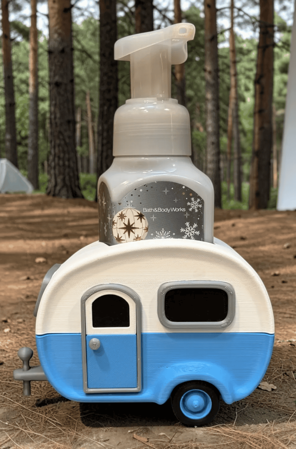 Hand sanitizer dispenser shaped like a camper trailer for kids. Acadiana3DPrints