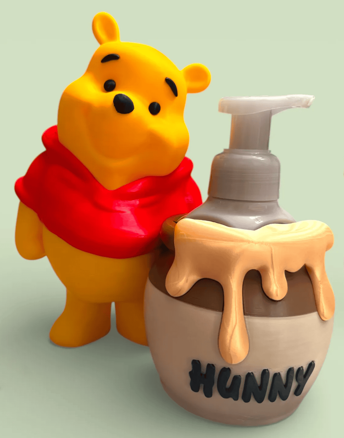 Pooh Bear figurine with hand soap dispenser labeled 'HUNNY'. Acadiana3DPrints