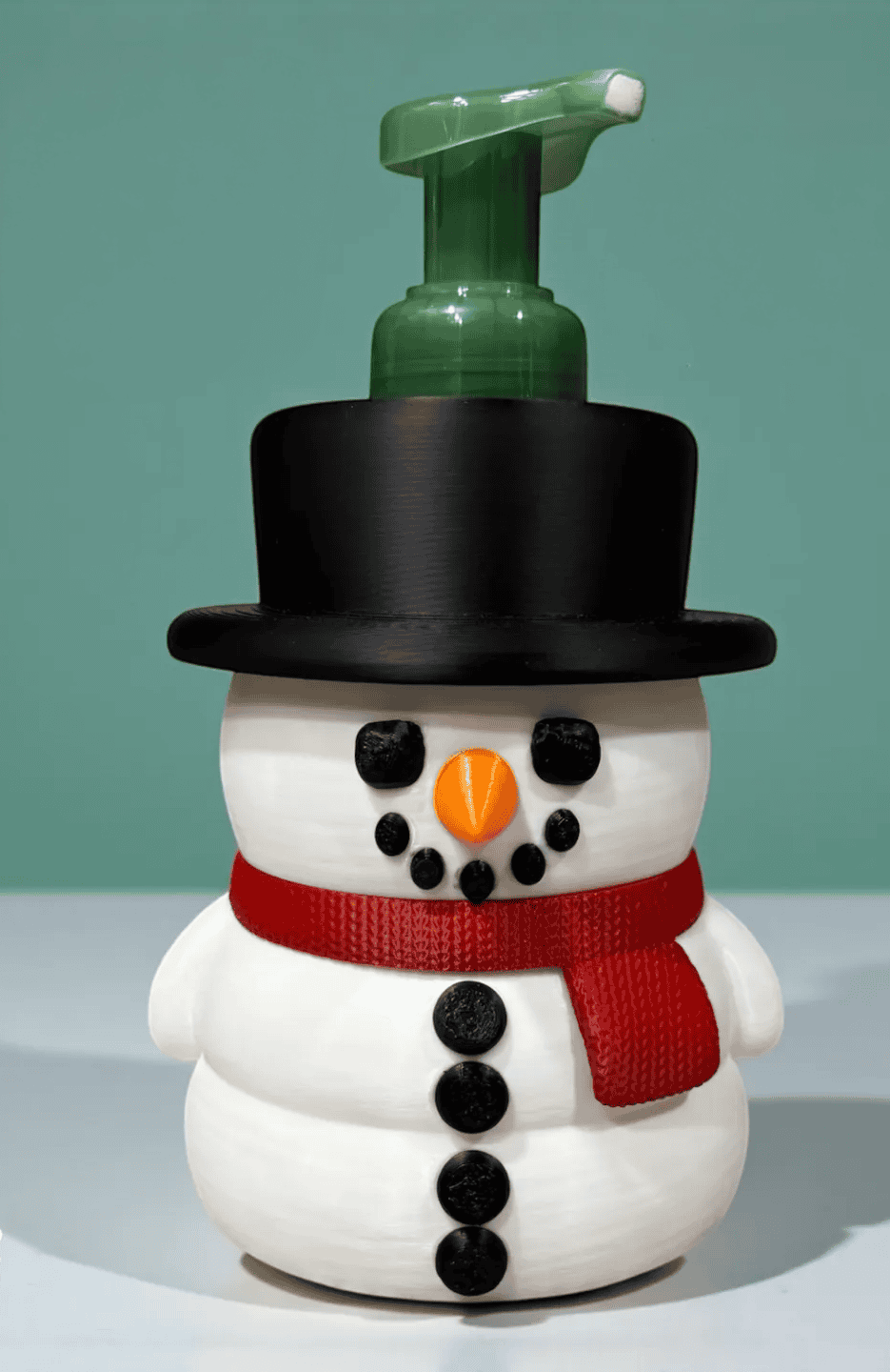 Snowman soap dispenser with a green top hat and red scarf for winter-themed decor. Acadiana3DPrints